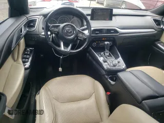 2018 Mazda CX-9 Grand Touring с VIN JM3TCADY9J0205299, выставлен на аукционе Copart как лот 60306095 с пробегом 113 766 миль миль и Списание • Salvage title. История ставок и продаж доступна на DreamBid. Изображение 8.