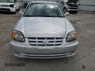 2004 Hyundai Accent GL with VIN KMHCG45C94U515186, listed as a Copart auction lot 52697284 with 49,236 mi miles and Salvage Title. Bid and sale history available at carsss.com. Image 5.