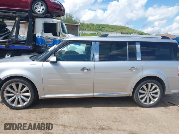 2013 Ford Flex Limited z VIN 2FMHK6DT4DBD20555, wystawiony jako IAAI lot #42182228 z przebiegiem 147 997 mil mil oraz . Historia ofert i sprzedaży dostępna na DreamBid. Obrazek 15.