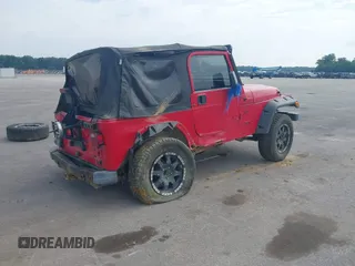 2001 Jeep Wrangler Sport z VIN 1J4FA49S31P335680, wystawiony jako IAAI lot #42471312 z przebiegiem 212 927 mil mil oraz . Historia ofert i sprzedaży dostępna na DreamBid. Obrazek 4.