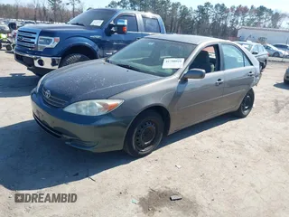2003 Toyota Camry LE with VIN 4T1BE32K63U659008, listed as a IAAI auction lot 41790929 with 206,878 mi miles and . Bid and sale history available at DreamBid. Image 2.