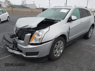 2016 Cadillac SRX Luxury Collection z VIN 3GYFNBE38GS520891, wystawiony jako IAAI lot #41781445 z przebiegiem 52 202 mil mil oraz . Historia ofert i sprzedaży dostępna na DreamBid. Obrazek 2.