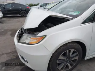 2014 Honda Odyssey Touring with VIN 5FNRL5H94EB001479, listed as a IAAI auction lot 41123678 with 147,269 mi miles and . Bid and sale history available at carsss.com. Image 18.