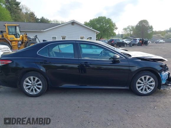 2020 Toyota Camry LE with VIN 4T1C11AK2LU393699, listed as a IAAI auction lot 42123267 with 66,932 mi miles and . Bid and sale history available at carsss.com. Image 14.