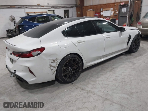 2020 BMW M8 with VIN WBSGV0C06LCE47698, listed as a IAAI auction lot 41457199 with 50,772 mi miles. Bid and sale history available at carsss.com. Image 4.