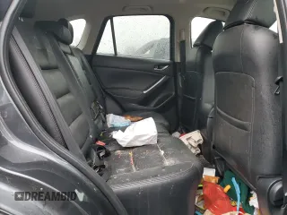 2016 Mazda CX-5 Grand Touring z VIN JM3KE2DY9G0687261, wystawiony jako Copart lot #52865415 z przebiegiem Nie podano mil oraz Szkoda całkowita • Salvage title. Historia ofert i sprzedaży dostępna na DreamBid. Obrazek 11.