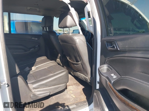 2019 Chevrolet Suburban LT with VIN 1GNSCHKC3KR143942, listed as a IAAI auction lot 41896633 with 153,139 mi miles and . Bid and sale history available at DreamBid. Image 8.