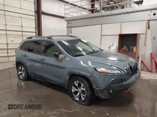 2014 Jeep Cherokee Trailhawk with VIN 1C4PJMBS6EW277192, listed as a IAAI auction lot 41793686 with 135,331 mi miles. Bid and sale history available at carsss.com. Image 1.