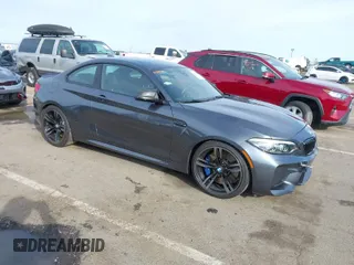 2018 BMW M2 with VIN WBS1J5C50JVE51869, listed as a IAAI auction lot 41814404 with 69,684 mi miles. Bid and sale history available at carsss.com. Image 1.