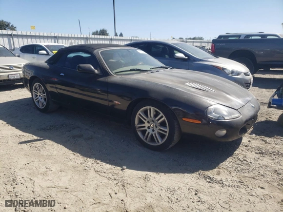 2001 Jaguar XK8 with VIN SAJDA42B51PA15157, listed as a Copart auction lot 67139634 with 110,506 mi miles and Salvage Title. Bid and sale history available at carsss.com. Image 4.