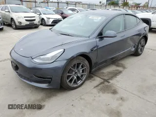 2023 Tesla Model 3 with VIN 5YJ3E1EA3PF697049, listed as a Copart auction lot 55601295 with 12,373 mi miles and Salvage Title. Bid and sale history available at DreamBid. Image 1.
