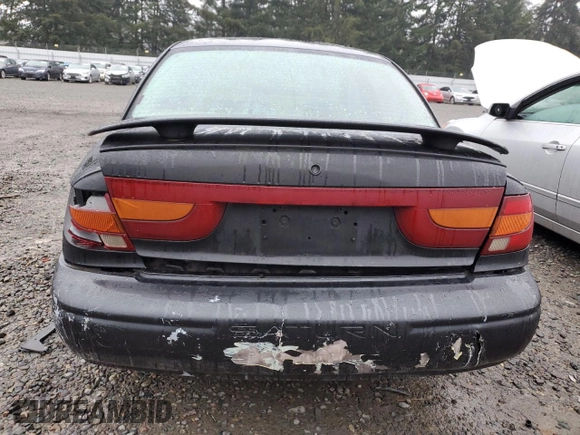 2000 Saturn SL with VIN 1G8ZK5270YZ269898, listed as a Copart auction lot 88082365 with 124,233 mi miles and Salvage title. Bid and sale history available at DreamBid. Image 6.