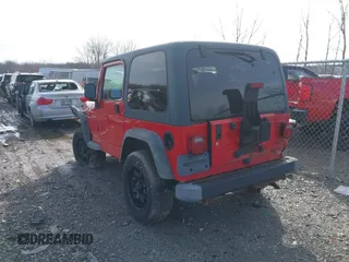 2003 Jeep Wrangler Sport with VIN 1J4FA49S53P305096, listed as a IAAI auction lot 41685209 with 165,247 mi miles. Bid and sale history available at carsss.com. Image 3.