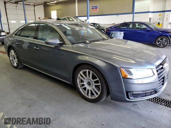 2015 Audi A8 with VIN WAUJGAFD3FN016587, listed as a Copart auction lot 60778904 with 116,818 mi miles and Clean title. Bid and sale history available at DreamBid. Image 4.