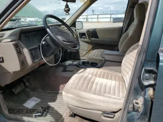 1993 Jeep Grand Cherokee Laredo with VIN 1J4GZ58Y8PC513026, listed as a Copart auction lot 57001465 with 135,242 mi miles and Clean title. Bid and sale history available at DreamBid. Image 7.