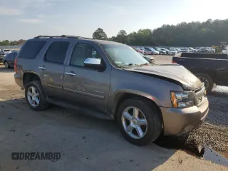 2011 Chevrolet Tahoe LS with VIN 1GNSCAE00BR395849, listed as a Copart auction lot 54750685 with 183,336 mi miles and Salvage title. Bid and sale history available at DreamBid. Image 4.