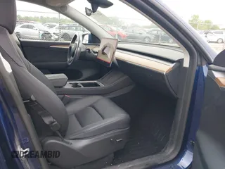 2023 Tesla Model Y Long Range z VIN 7SAYGDEE0PF840787, wystawiony jako IAAI lot #42172489 z przebiegiem 16 314 mil mil oraz . Historia ofert i sprzedaży dostępna na DreamBid. Obrazek 5.
