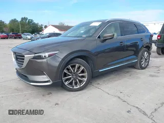 2017 Mazda CX-9 Grand Touring with VIN JM3TCADY7H0133092, listed as a IAAI auction lot 41133652 with 233,454 mi miles and . Bid and sale history available at DreamBid. Image 2.