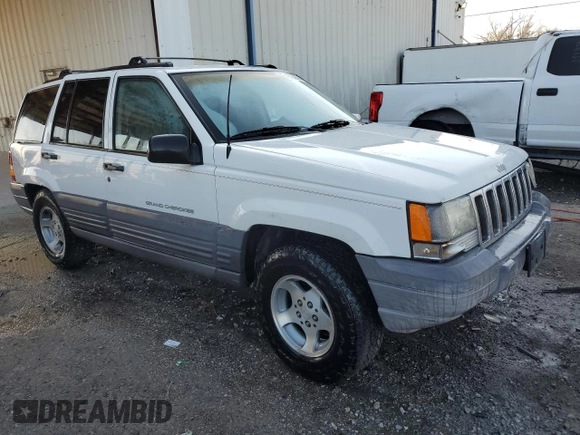 1997 Jeep Grand Cherokee TSi with VIN 1J4FX58S2VC612449, listed as a Copart auction lot 43532675 with 221,382 mi miles and Salvage Title. Bid and sale history available at carsss.com. Image 4.