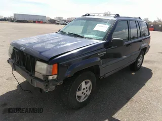 1994 Jeep Grand Cherokee Laredo with VIN 1J4GZ58Y3RC202638, listed as a IAAI auction lot 41885484 with 164,481 mi miles. Bid and sale history available at carsss.com. Image 2.