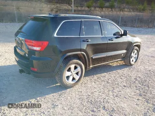 2012 Jeep Grand Cherokee Laredo with VIN 1C4RJFAG3CC246577, listed as a IAAI auction lot 41807693 with 164,574 mi miles. Bid and sale history available at carsss.com. Image 4.