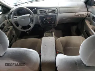 2005 Ford Taurus SE with VIN 1FAFP53215A133518, listed as a Copart auction lot 59615205 with 127,778 mi miles and Salvage title. Bid and sale history available at DreamBid. Image 8.