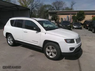 2014 Jeep Compass Sport with VIN 1C4NJDBB2ED774078, listed as a IAAI auction lot 42038110 with 104,606 mi miles. Bid and sale history available at carsss.com. Image 1.