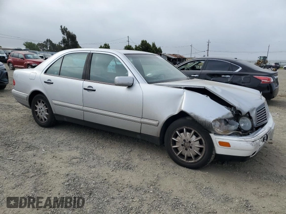 1999 Mercedes-Benz E-Class with VIN WDBJF65H0XA797390, listed as a Copart auction lot 55081405 with 80,950 mi miles and Salvage Title. Bid and sale history available at carsss.com. Image 4.