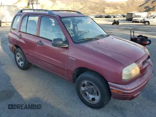 1999 Suzuki Vitara JX z VIN 2S3TD52V6X6101702, wystawiony jako Copart lot #42596125 z przebiegiem 225 614 mil mil oraz Tytuł czysty. Historia ofert i sprzedaży dostępna na DreamBid. Obrazek 4.