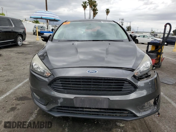 2017 Ford Focus SE with VIN 1FADP3FE3HL235896, listed as a Copart auction lot 50910975 with 74,502 mi miles and Salvage Title. Bid and sale history available at carsss.com. Image 5.