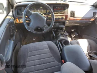 1997 Jeep Grand Cherokee Laredo with VIN 1J4GZ58S7VC505069, listed as a Copart auction lot 63255945 with 127,552 mi miles and Salvage title. Bid and sale history available at DreamBid. Image 8.