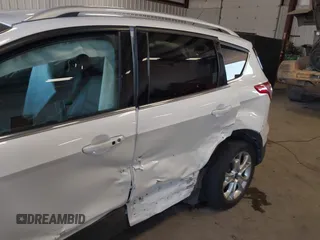 2016 Ford Escape Titanium with VIN 1FMCU9J94GUC28648, listed as a IAAI auction lot 42043761 with 82,509 mi miles and . Bid and sale history available at DreamBid. Image 6.
