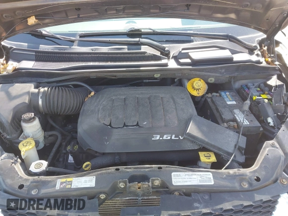 2015 Dodge Grand Caravan SE with VIN 2C4RDGBG2FR684367, listed as a IAAI auction lot 42167621 with 216,628 mi miles and . Bid and sale history available at DreamBid. Image 10.