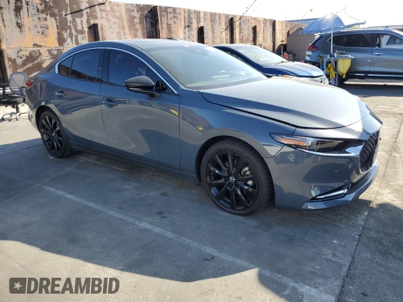 2023 Mazda 3 Premium Plus with VIN 3MZBPBEY5PM374977, listed as a Copart auction lot 70642804 with 9,029 mi miles and Salvage Title. Bid and sale history available at DreamBid. Image 4.