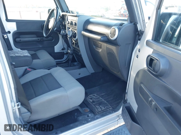 2010 Jeep Wrangler Unlimited Sahara with VIN 1J4BA5H14AL230604, listed as a IAAI auction lot 41884346 with 97,060 mi miles. Bid and sale history available at carsss.com. Image 5.