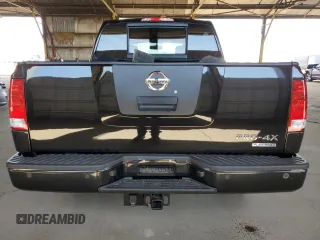 2011 Nissan Titan Pro-4X z VIN 1N6BA0EC9BN304469, wystawiony jako Copart lot #52982815 z przebiegiem 108 829 mil mil oraz Szkoda całkowita • Salvage title. Historia ofert i sprzedaży dostępna na DreamBid. Obrazek 6.