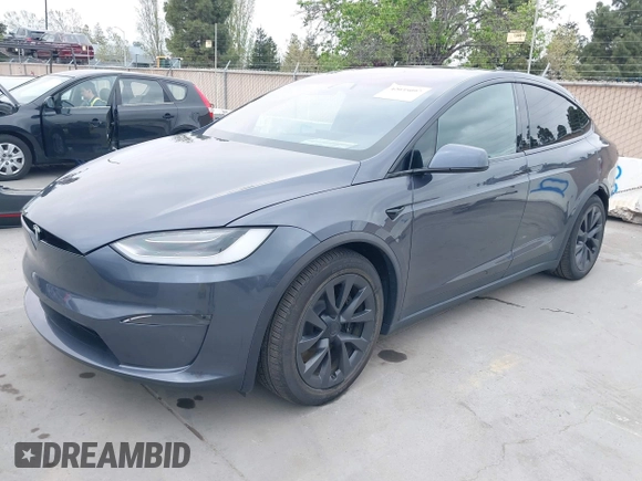 2022 Tesla Model X Plaid with VIN 7SAXCBE6XNF337687, listed as a IAAI auction lot 42035097 with 18,756 mi miles and . Bid and sale history available at DreamBid. Image 2.