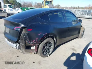 2022 Tesla Model Y Long Range with VIN 7SAYGDEEXNF424856, listed as a IAAI auction lot 41059718 with 44,439 mi miles and . Bid and sale history available at carsss.com. Image 4.