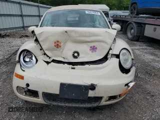 2009 Volkswagen Beetle S with VIN 3VWRF31Y99M409195, listed as a Copart auction lot 55010054 with 99,635 mi miles and Salvage title. Bid and sale history available at DreamBid. Image 5.
