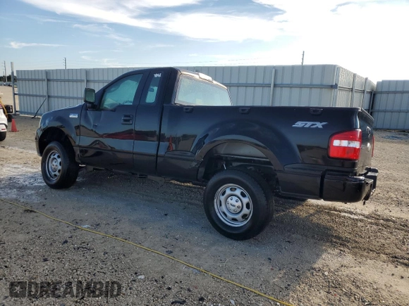 2007 Ford F-150 STX with VIN 1FTRF02297KD15057, listed as a Copart auction lot 73847974 with 184,413 mi miles and Salvage Title. Bid and sale history available at carsss.com. Image 2.