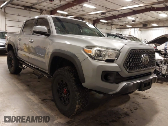 2019 Toyota Tacoma SR z VIN 3TMCZ5AN1KM232360, wystawiony jako IAAI lot #42006355 z przebiegiem 133 909 mil mil oraz . Historia ofert i sprzedaży dostępna na DreamBid. Obrazek 1.