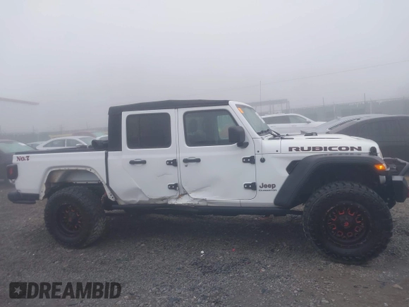 2022 Jeep Gladiator Rubicon z VIN 1C6JJTBG3NL111054, wystawiony jako IAAI lot #40793144 z przebiegiem 40 115 mil mil oraz . Historia ofert i sprzedaży dostępna na DreamBid. Obrazek 14.