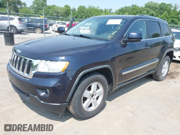 2011 Jeep Grand Cherokee Laredo with VIN 1J4RR4GG2BC550934, listed as a IAAI auction lot 42467947 with 198,904 mi miles and . Bid and sale history available at DreamBid. Image 2.