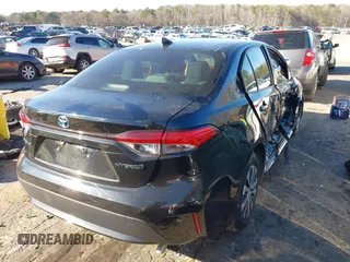2022 Toyota Corolla Hybrid LE with VIN JTDEAMDE2NJ039206, listed as a IAAI auction lot 41592129 with 97,593 mi miles. Bid and sale history available at carsss.com. Image 4.
