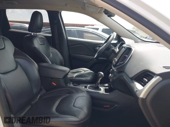 2014 Jeep Cherokee Trailhawk with VIN 1C4PJMBS5EW231448, listed as a IAAI auction lot 42632143 with 97,461 mi miles and . Bid and sale history available at DreamBid. Image 5.