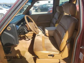 1992 Dodge Dakota z VIN 1B7GL23YXNS633409, wystawiony jako Copart lot #51067775 z przebiegiem 153 174 mil mil oraz Szkoda całkowita • Salvage title. Historia ofert i sprzedaży dostępna na DreamBid. Obrazek 7.