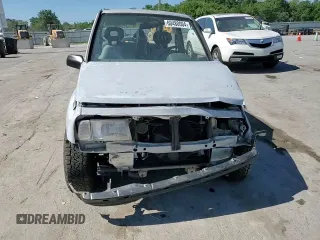 1991 Geo Tracker z VIN 2CNBJ18U3M6909006, wystawiony jako Copart lot #73638944 z przebiegiem 65 033 mil mil oraz Tytuł czysty. Historia ofert i sprzedaży dostępna na DreamBid. Obrazek 10.