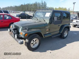 1997 Jeep Wrangler Sahara with VIN 1J4FY49S4VP523156, listed as a IAAI auction lot 42046797 with 193,408 mi miles. Bid and sale history available at carsss.com. Image 2.