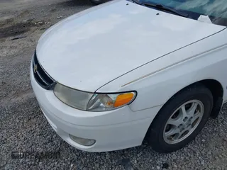 1999 Toyota Solara SE with VIN 2T1CF22PXXC233661, listed as a IAAI auction lot 42196878 with 157,682 mi miles. Bid and sale history available at carsss.com. Image 6.
