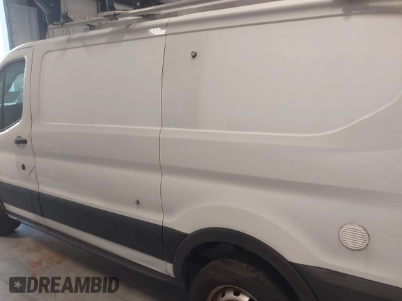 2020 Ford Transit Cargo with VIN 1FTBR1Y81LKA19650, listed as a IAAI auction lot 42727232 with 103,676 mi miles and . Bid and sale history available at DreamBid. Image 14.
